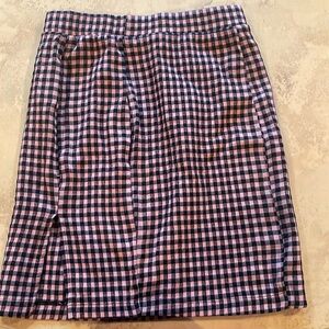 Plaid unbranded baby pink and black skirt with small slit on the side stretchy